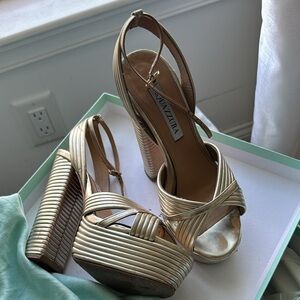 Aquazzura Metallic Gold Strappy Platforms 
Sundance